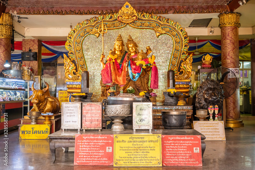 Images of Shiva and Uma Devi and Ganesha Sacred Is a lot of Buddhists Often come to pay respect here at Huai Khwang Market, Bangkok, Thailand photo