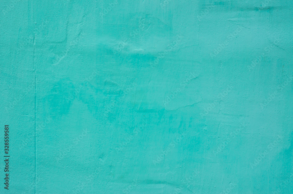 The wall of knowledge is painted in turquoise color. Background, texture
