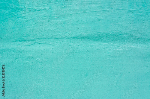 The wall of knowledge is painted in turquoise color. Background, texture