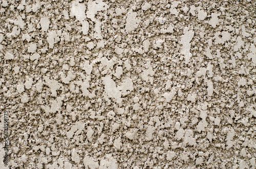 Background image of a wall with decorative plaster.