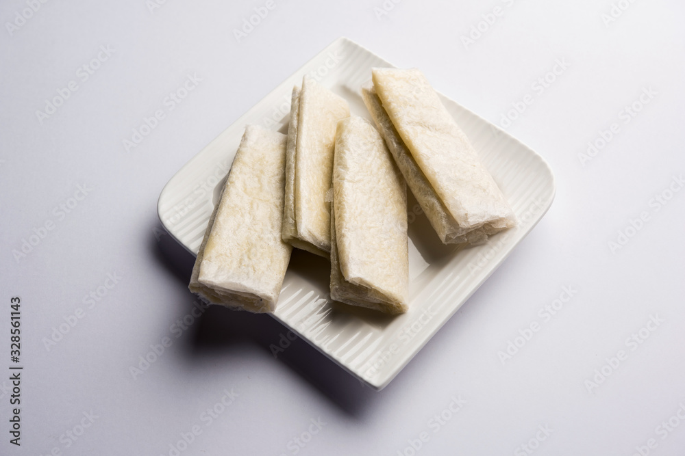 Pootharekulu is a popular recipe originated from Andhra Pradesh, India.It is a paper-thin sweet or dessert made from rice start/gram flour, jaggery/sugar and clarified butter. Served in a plate. Pootharekulu is a popular recipe originated from Andhra Pradesh, India.It is a paper-thin sweet or dessert made from rice start/gram flour, jaggery/sugar and clarified butter. Served in a plate.