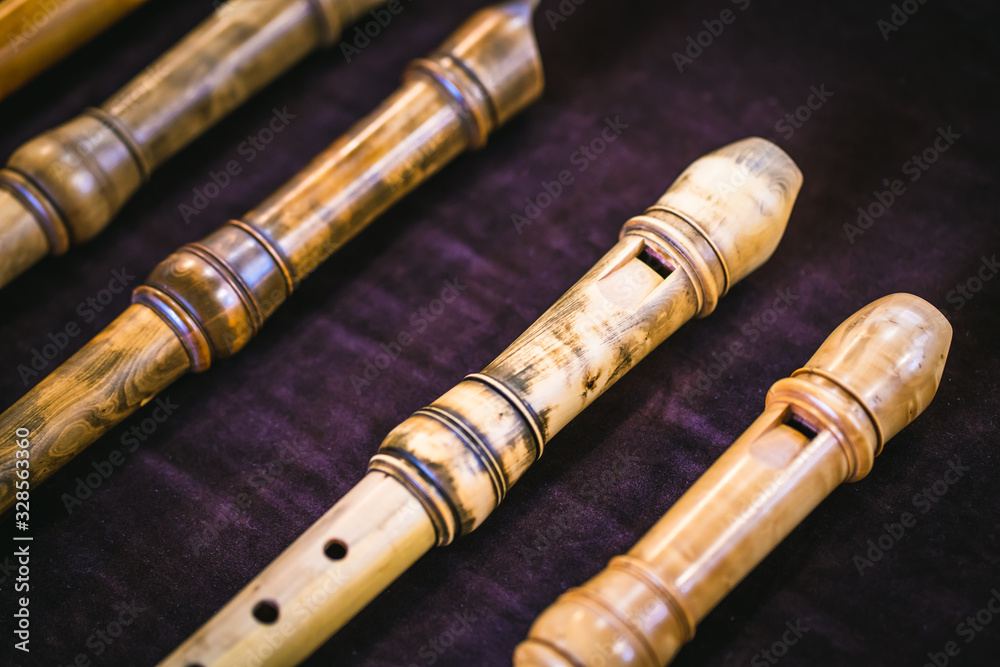 Early Music Historical Instrument - Baroque Recorders with purple background