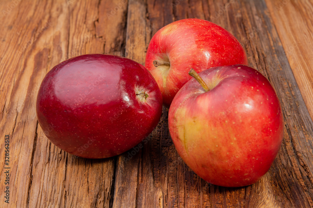 ripe red apples on a wooden table ripe red apples on a wooden table