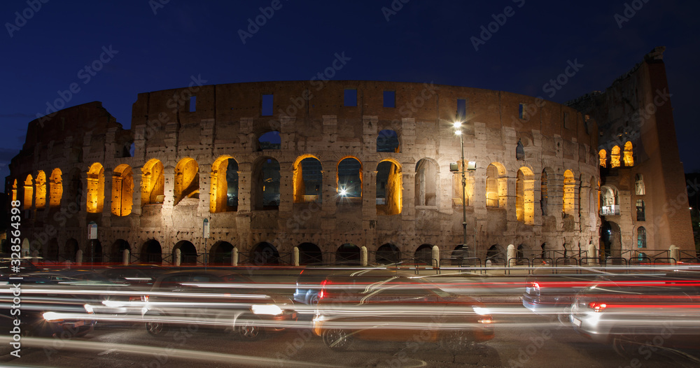 Night car traffic at the Coliseum in Rome