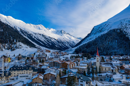 Winter landscape of mountains and small city 