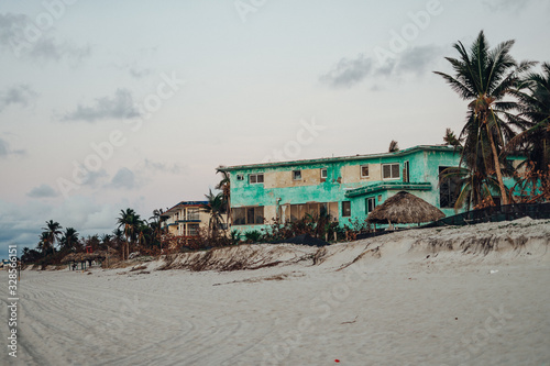Abandoned Turquoise house on the beach of varadero at sunset