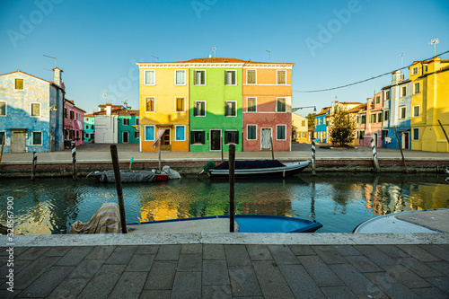 colorful houses on Burano Island, reflection in the canal 