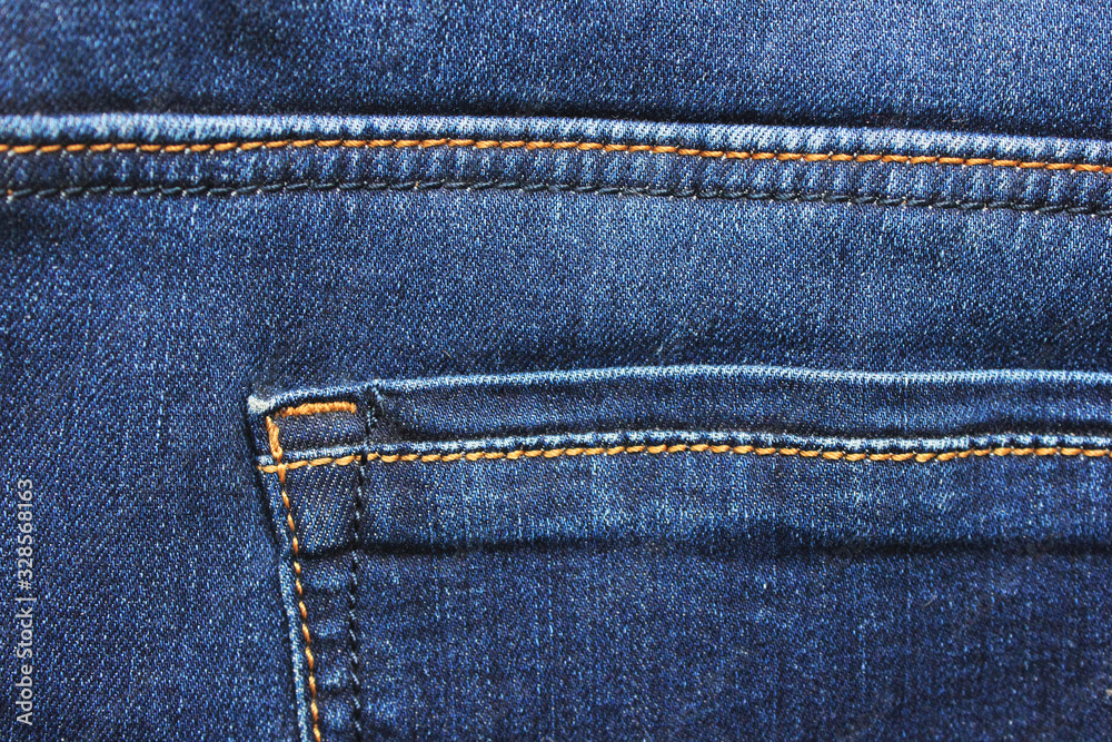 Denim jeans backside detail close up, pocket seams structure pattern. Casual dark blue jeans, denim pants fragment close up top view Denim jeans backside detail close up, pocket seams structure pattern. Casual dark blue jeans, denim pants fragment close up top view
