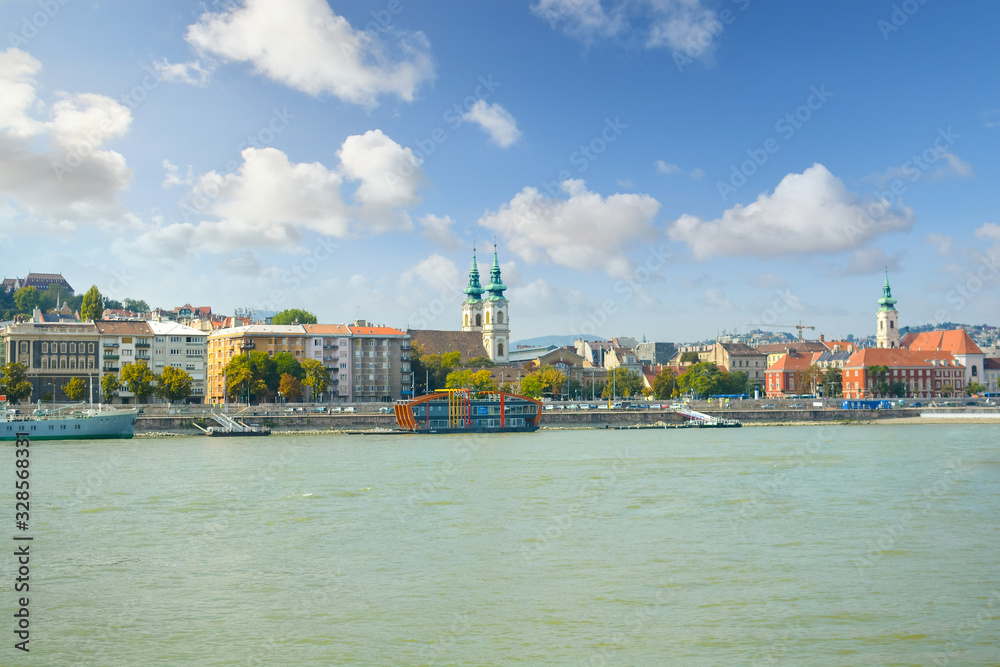 Naklejka premium Church of St. Anne on the Buda side of the Danube river is visible from a boat on the Danube in Budapest, Hungary