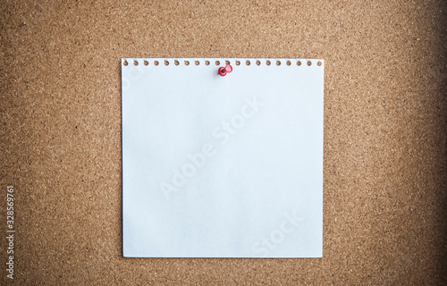 white paper on cork background