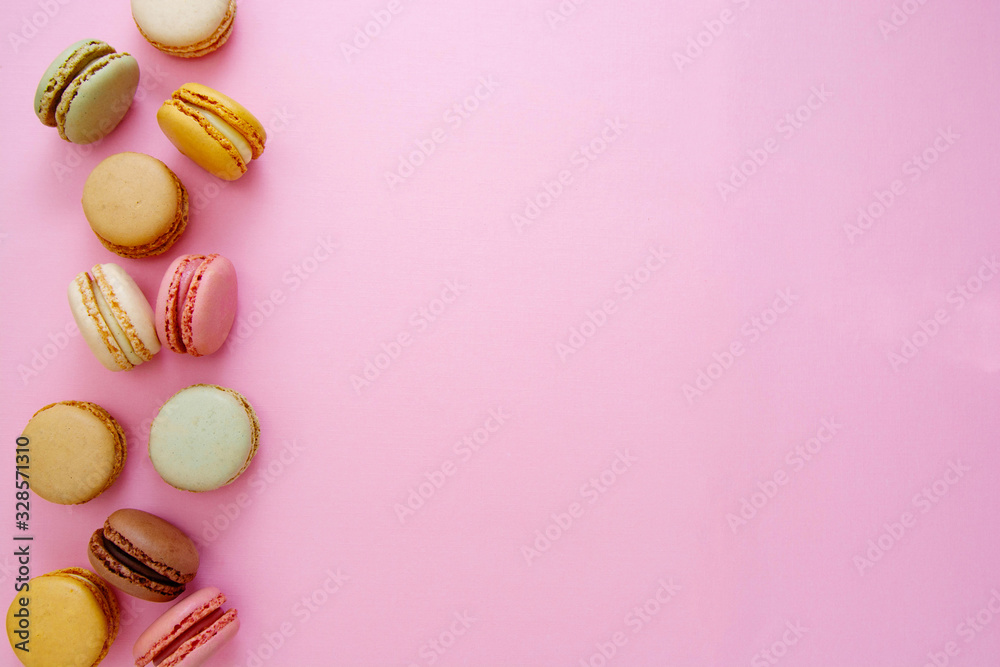 Colorful abstract pink background with french macaroons cookies, copy space. Feminine or beauty background. Colorful abstract pink background with french macaroons cookies, copy space. Feminine or beauty background.