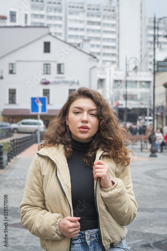 Stylish modern girl posing for a photo in the street © bisonov