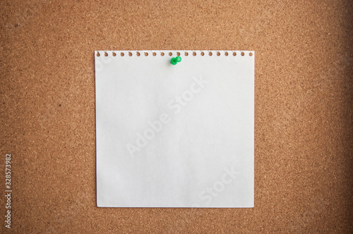 white paper on cork background