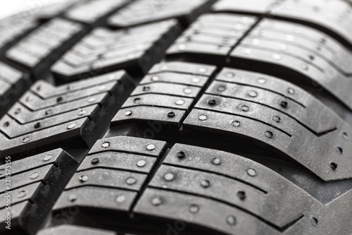 Car tire close up isolated on white background.