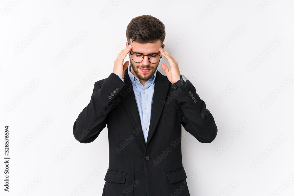 Young caucasian business man posing in a white background isolated Young caucasian business man touching temples and having headache. Young caucasian business man posing in a white background isolated Young caucasian business man touching temples and having headache.