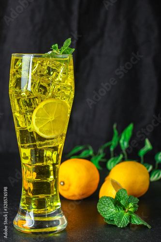 lemonade with ice, lemon and mint, a refreshing drink, menu concept food background. top view. copy space for text