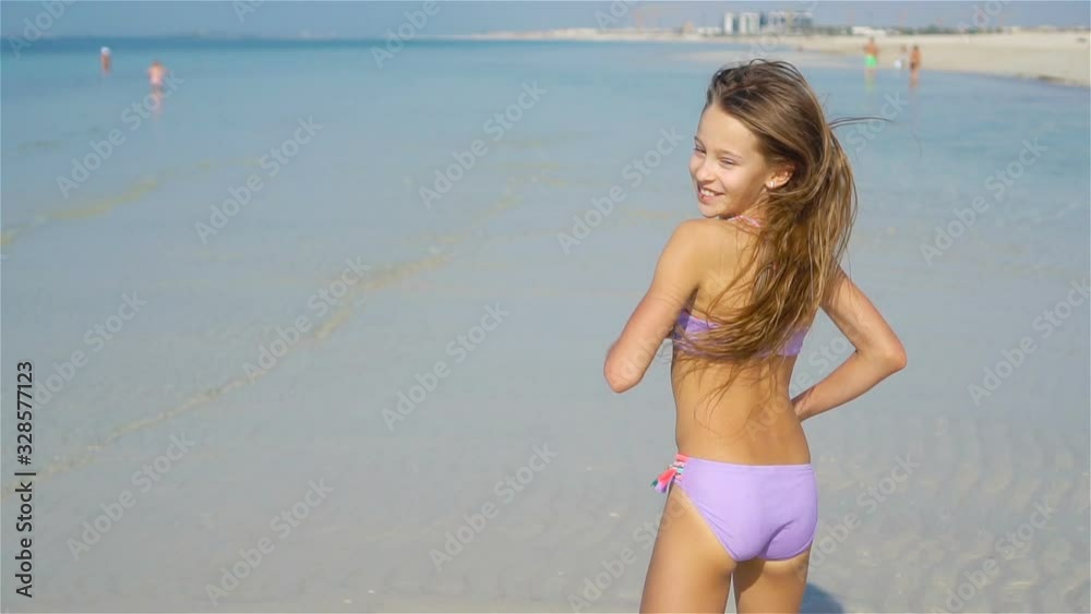 Cute little girl at beach during summer vacation Stock ビデオ | Adobe Stock 