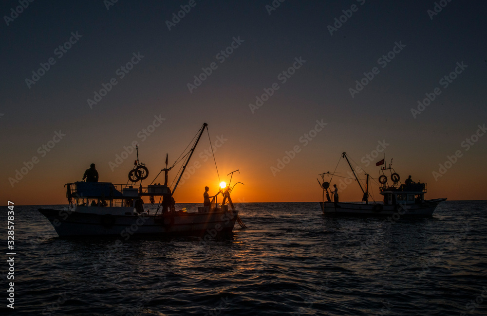 sunset fishermen