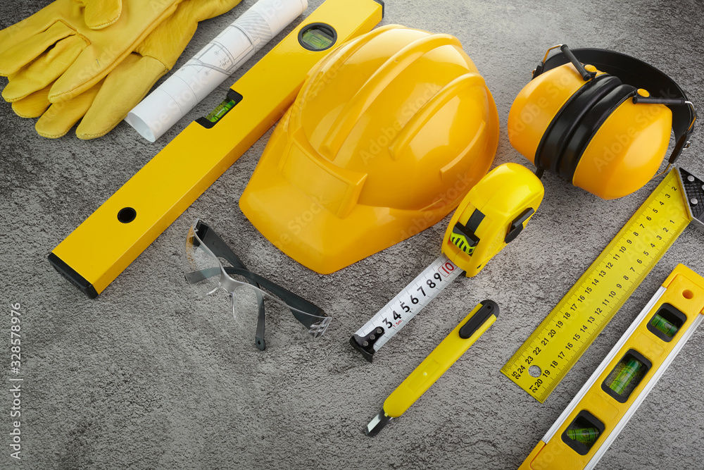 Fototapeta premium Building industry concept. Architectural background. Construction helmet.