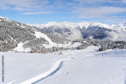 Winter scenery with ski slope and ski trace © raeva