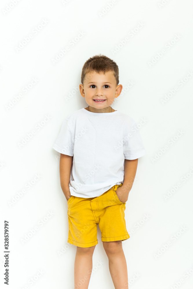 Cute little boy in yellow shorts and white t-shirt Cute little boy in yellow shorts and white t-shirt