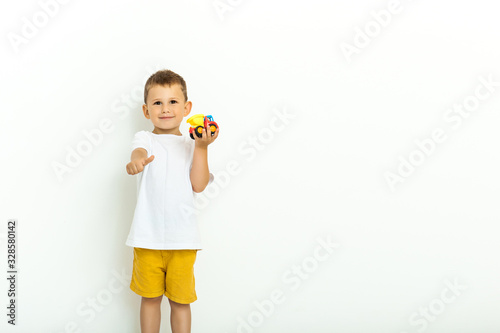 Cute little boy playing with a toy