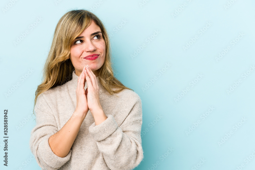 Young blonde caucasian woman making up plan in mind, setting up an idea. Young blonde caucasian woman making up plan in mind, setting up an idea.