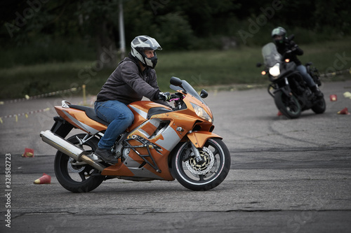 Riga, Latvia - 16.06.2019 Motorcycle gymkhana sport. A biker on a motorcycle. Motorcycling. Open moto fest. photo