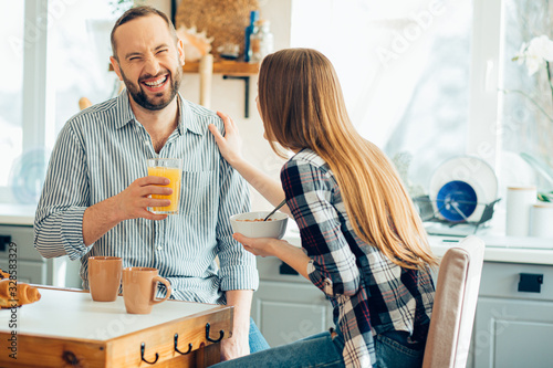 Amused man laughing during lunch stock photo