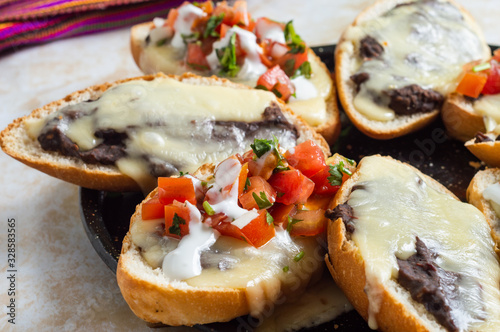Molletes, Vegetarian Mexican Food With Beans and Cheese photo