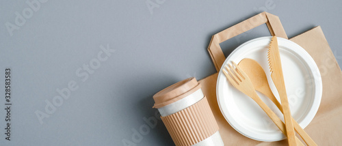 Eco-friendly travel cutlery set and bamboo coffee cup. Top view with copy space. Zero waste, plastic free concept. Sustainable lifestyle