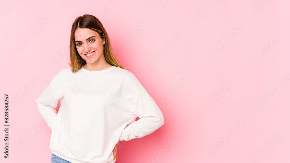 Young caucasian woman isolated on pink background happy, smiling and cheerful. Young caucasian woman isolated on pink background happy, smiling and cheerful.