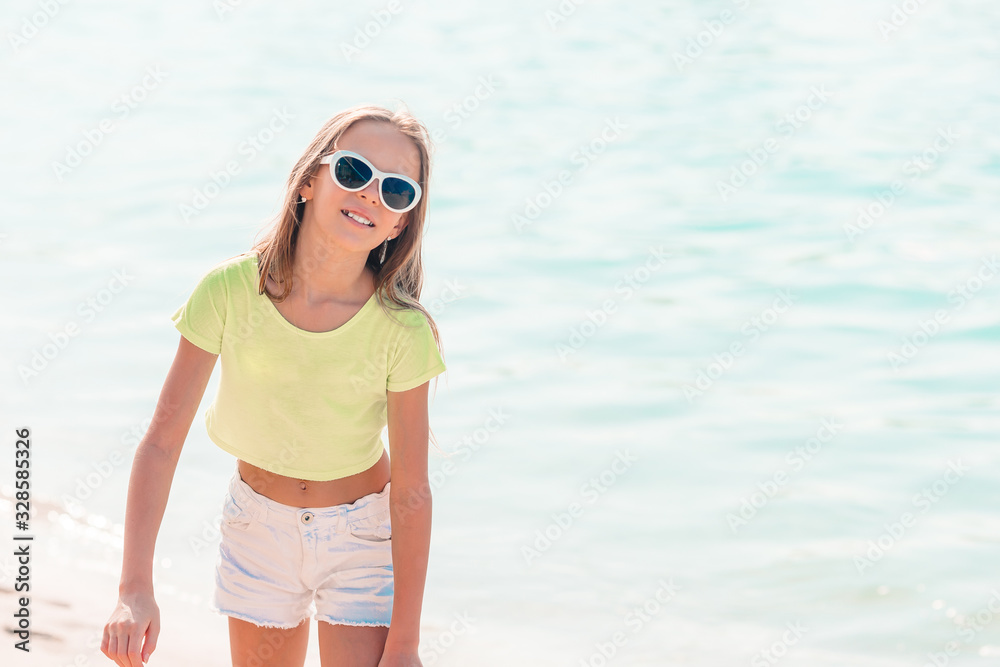 Cute little girl at beach during caribbean vacation Cute little girl at beach during caribbean vacation