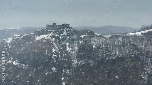 Ruins of a citadel from Transylvania during winter time.
The Soimos Fortress is located near Arad City - Western Romania. photo