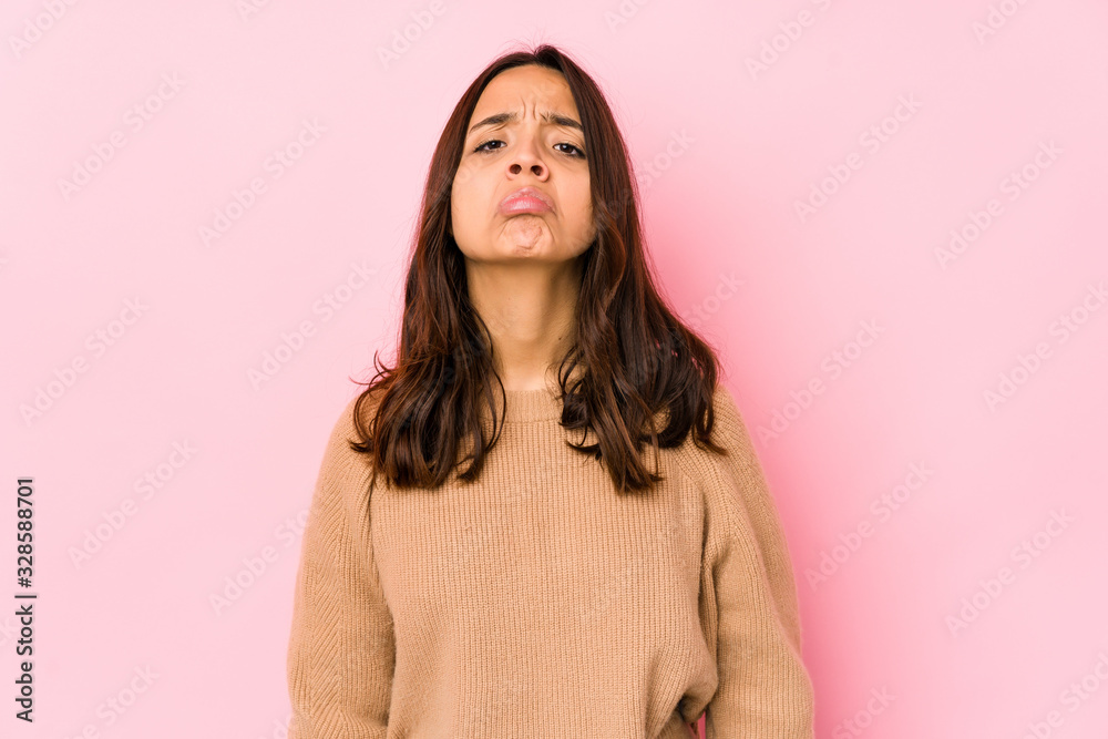 Young mixed race hispanic woman isolated sad, serious face, feeling miserable and displeased. Young mixed race hispanic woman isolated sad, serious face, feeling miserable and displeased.