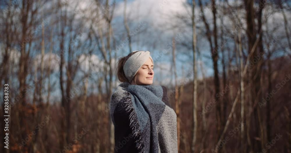 hapy woman smiling into camera in autumn hapy woman smiling into camera in autumn