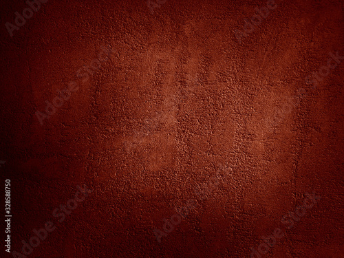 Red abstract background. Toned rough concrete texture with cracks and scratches. Blood red background. Grunge or horror background.