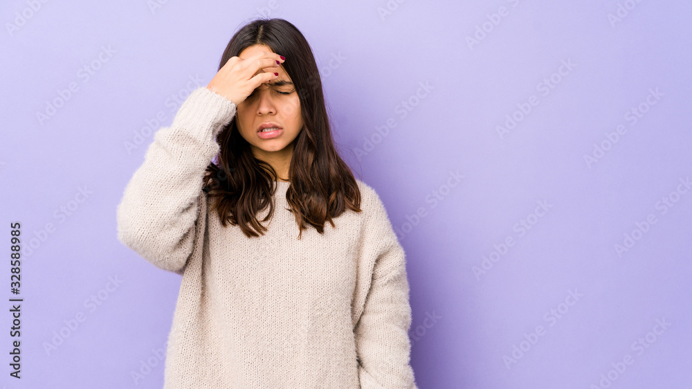 Young mixed race hispanic woman isolated having a head ache, touching front of the face. Young mixed race hispanic woman isolated having a head ache, touching front of the face.