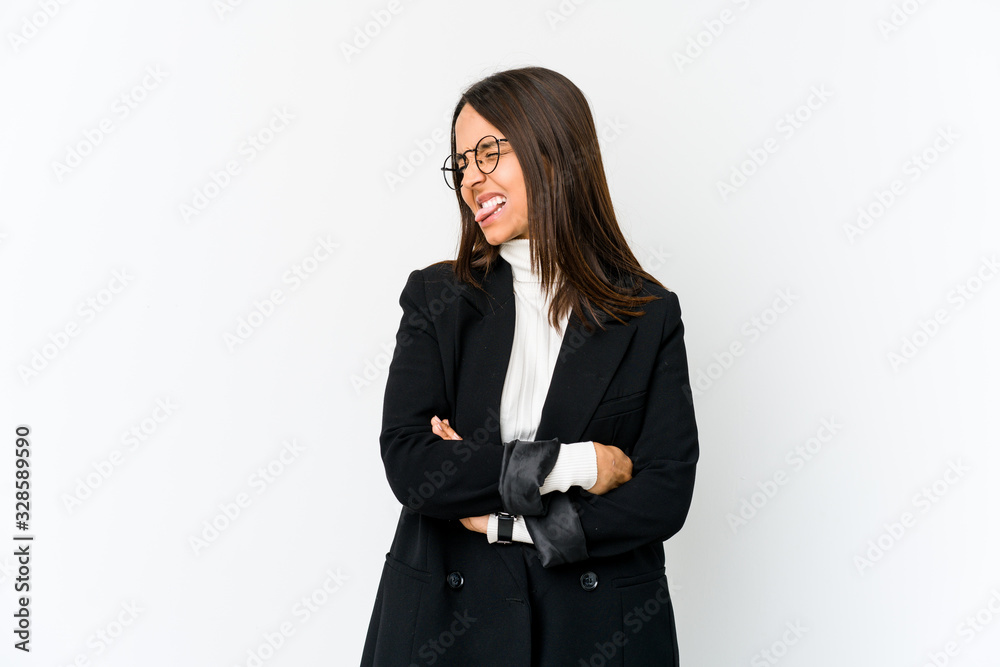 Young mixed race business woman isolated on white background funny and friendly sticking out tongue. Young mixed race business woman isolated on white background funny and friendly sticking out tongue.