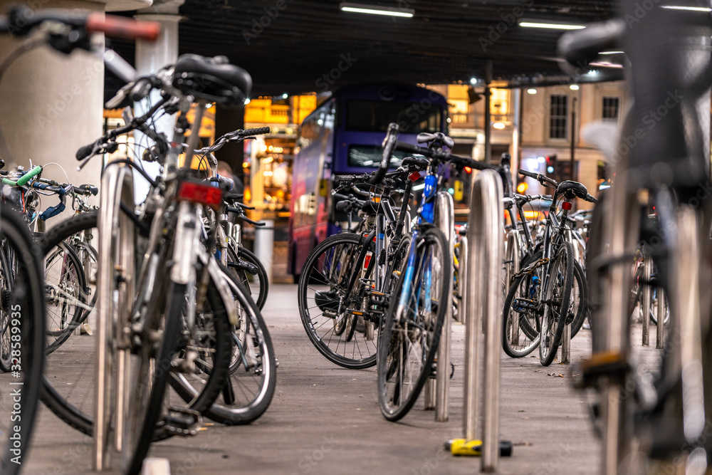 bicycles in a parking rack at night in London, UK bicycles in a parking rack at night in London, UK