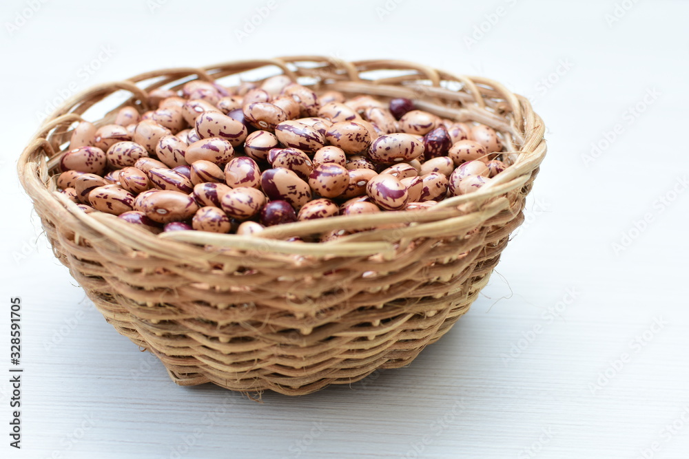 Raw bean grains (Phaseolus vulgaris) displayed in bowl Raw bean grains (Phaseolus vulgaris) displayed in bowl