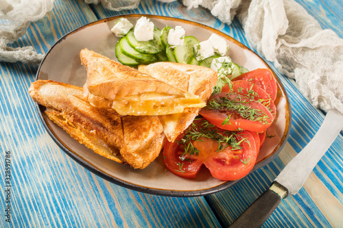 Sandwiches with cheese, tomatoes and cucumber.