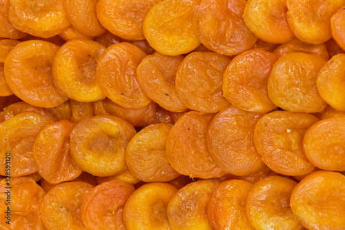 Background and texture of dried apricots.