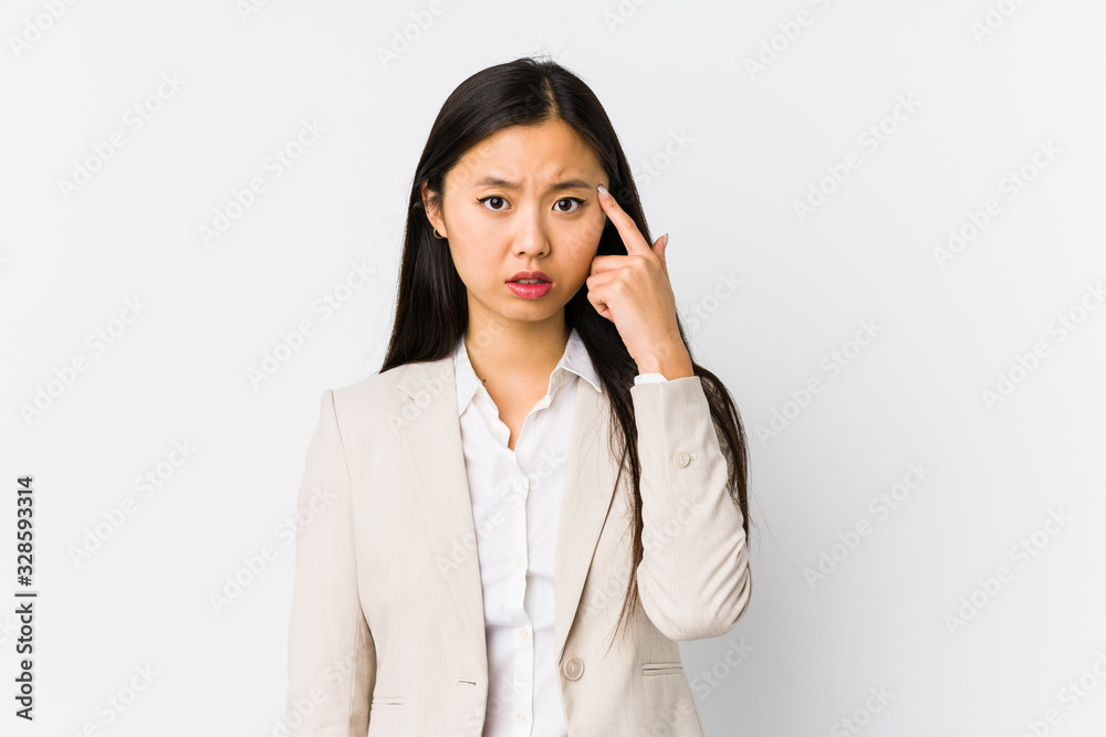 Young chinese business woman isolated showing a disappointment gesture with forefinger. Young chinese business woman isolated showing a disappointment gesture with forefinger.