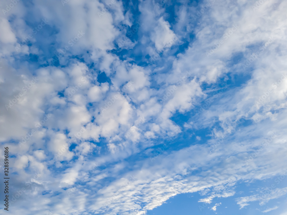 Fluffy white clouds in perspective in the blue sky. Fluffy white clouds in perspective in the blue sky.