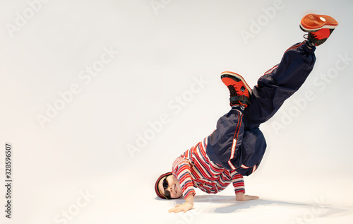 Quadro em tela a little boy in a unique breakdance pose, a unique dance position, a crazy kid