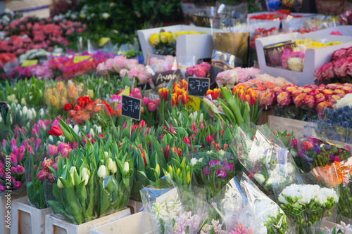 Fototapeta Naklejka Na Ścianę i Meble -  Bouquets of various flowers on the street flower market, holiday gifts, International Women's Day, Mother's Day. Selective focus
