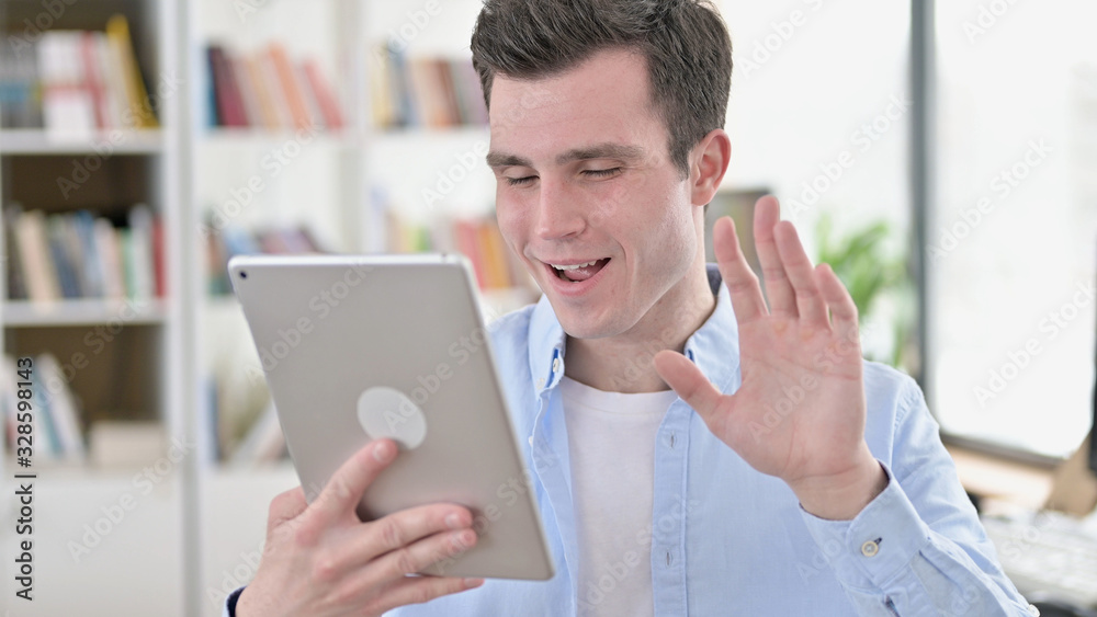 Online Video Chat on Tablet by Young Man Online Video Chat on Tablet by Young Man