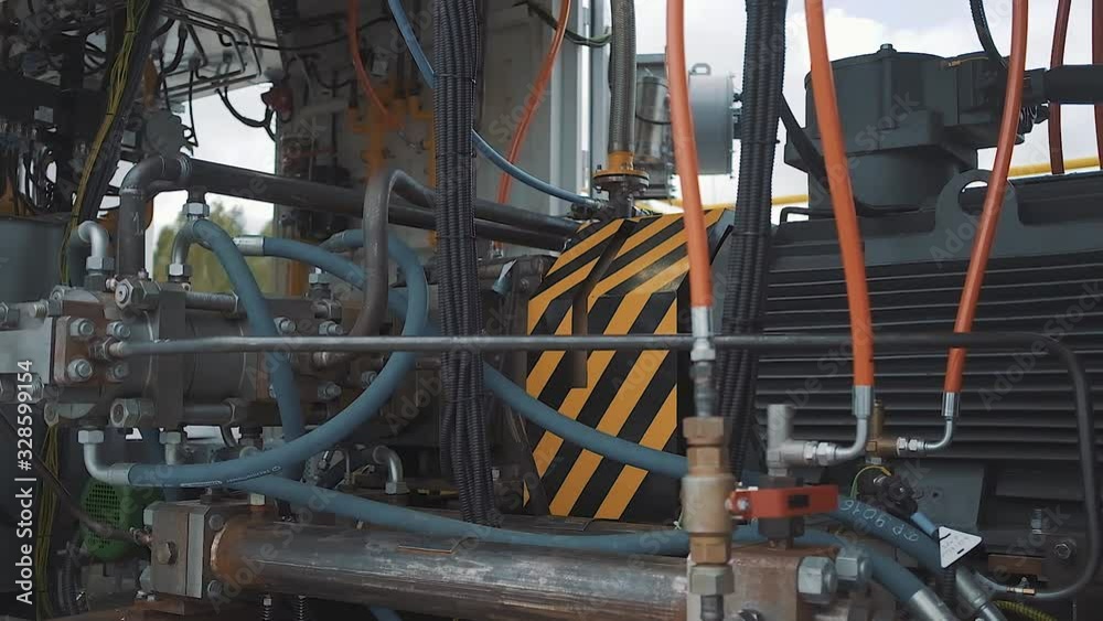 Outside factory compartment with many pipes and complex mechanisms