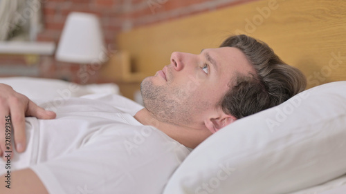 Portrait of Young Man Wake up and Leave the Bed